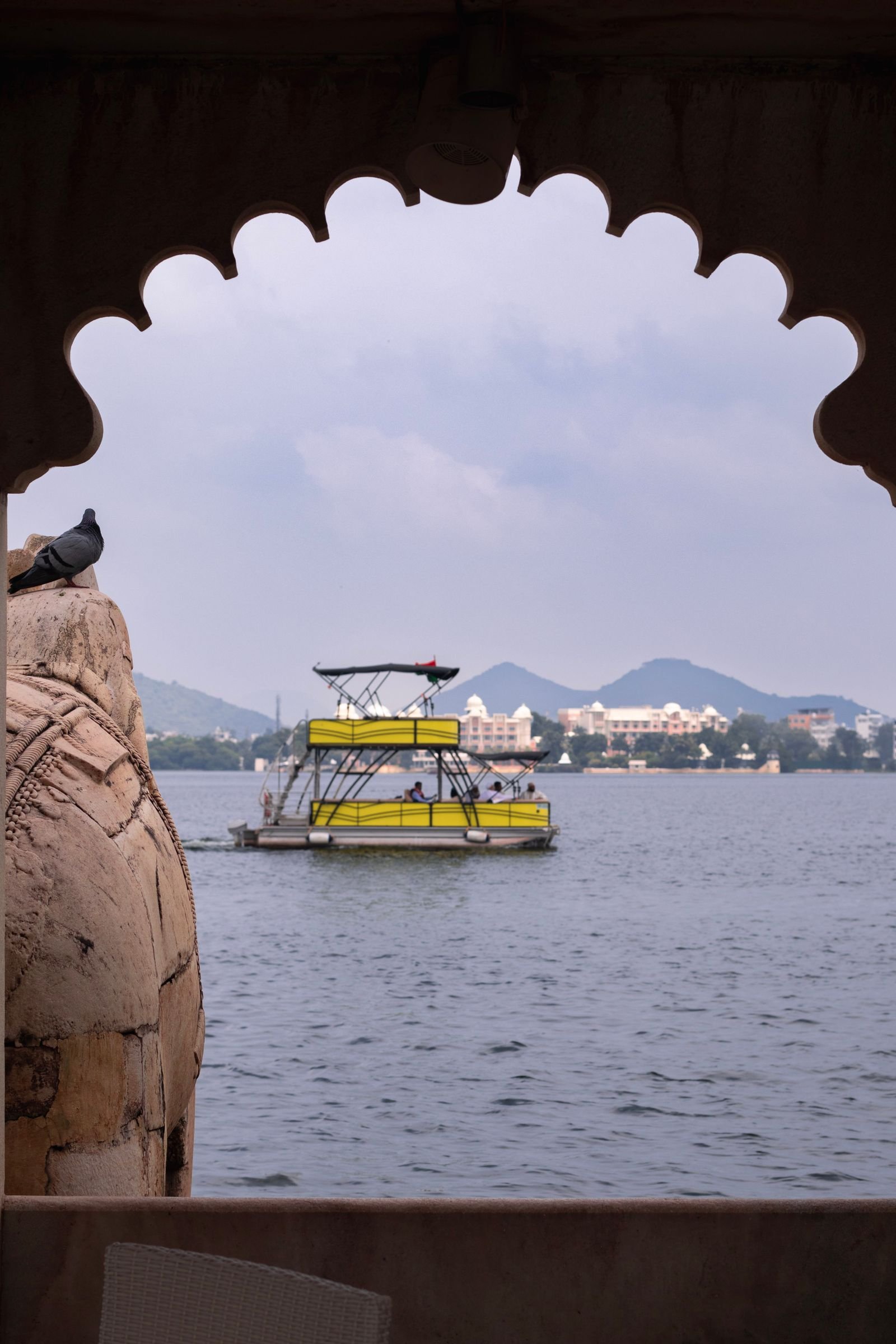 A boat ride across Lake Pichola, framed by the ghats of the old city